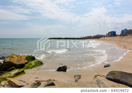 Beach and sea in bright sunlight Beach and sea in bright sunlight 64919872