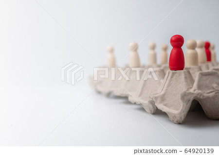 A wooden figure standing with team to influence A wooden figure standing with team to influence 64920139