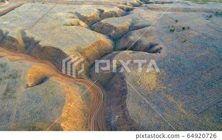 Soil erosion in the steppe zone of the Caspian lowland. Aerial view. Soil erosion in the steppe zone of the Caspian lowland. Aerial view. 64920726
