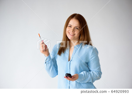 Diabetic patient measuring glucose level blood test using glucometer and small drop of blood Diabetic patient measuring glucose level blood test using glucometer and small drop of blood 64920993