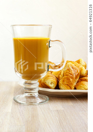 Milk coffee gluss cup and white plate of Milk coffee gluss cup and white plate of 64921316