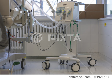Medical ventilator and hospital bed in ICU 64921387