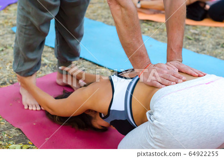 man and woman perform asana pair yoga 64922255