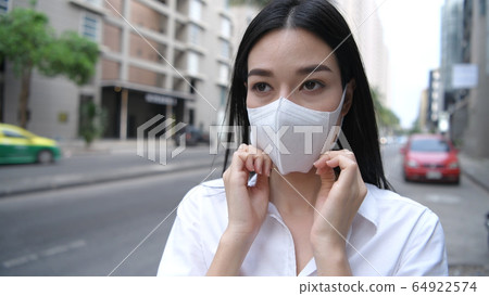 Concept of pollution prevention. The girl is Concept of pollution prevention. The girl is 64922574