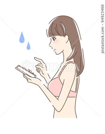 Side profile of anxious woman operating a smartphone Side profile of anxious woman operating a smartphone 64923466