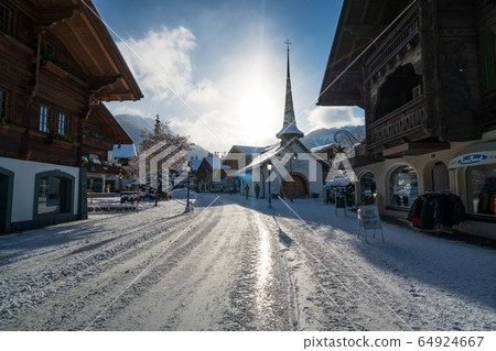 Gstaad promenade in winter time 64924667