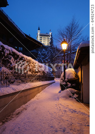 A road in Gstaad winter village  A road in Gstaad winter village  64924723