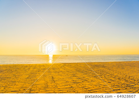 Beautiful tropical beach sea ocean with sunset or sunrise for travel vacation Beautiful tropical beach sea ocean with sunset or sunrise for travel vacation 64928607