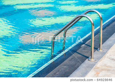 Stair around outdoor swimming pool in hotel resort 64928646