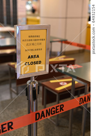 An outdoor eatery placed a standing closed sign for a pandemic lockdown period, it is in Chinese and English language An outdoor eatery placed a standing closed sign for a pandemic lockdown period, it is in Chinese and English language 64932154