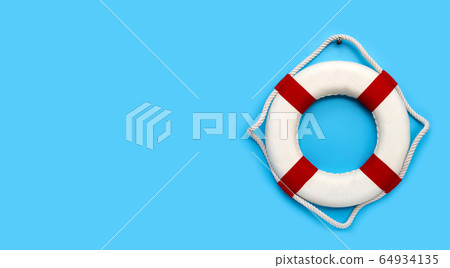 Lifebuoy on blue background. Copy space 64934135