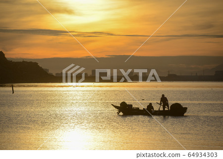 Silhouette fisherman fishing in sea Silhouette fisherman fishing in sea 64934303