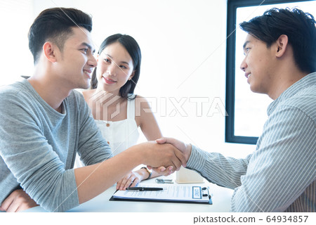 Buying something special. Young loving couple Buying something special. Young loving couple 64934857