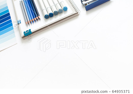 Classic Blue. Color of the Year 2020. Top view of workspace with white notebook, color palette, fabric sample and copy space. Flatlay minimalism. Classic Blue. Color of the Year 2020. Top view of workspace with white notebook, color palette, fabric sample and copy space. Flatlay minimalism. 64935371