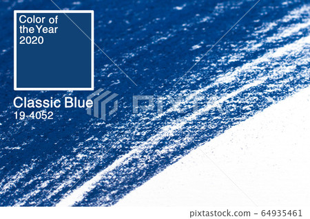 Classic Blue. Color of the Year 2020. Brush stroke of blue paint on white paper. 64935461