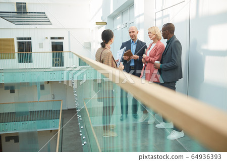 Business team meeting at office building Business team meeting at office building 64936393