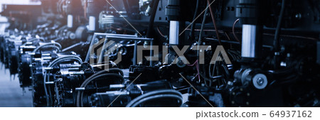 Heavy tractor on the conveyor of an automobile metallurgical plant 64937162