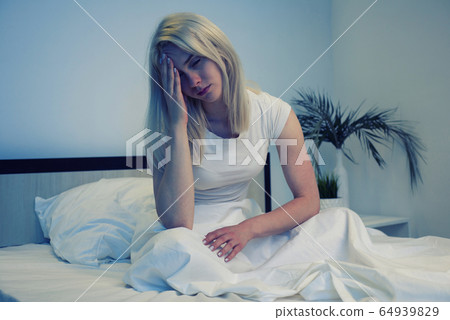 Depressed woman awake in the night, she is 64939829