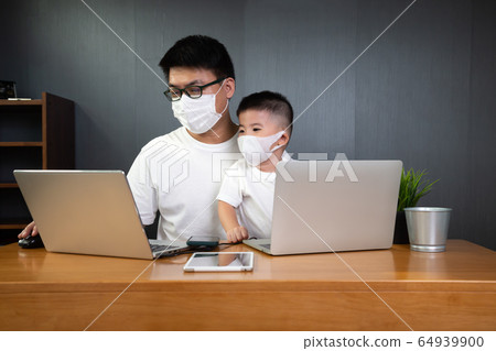 Asian man it support working on computer laptop to 64939900