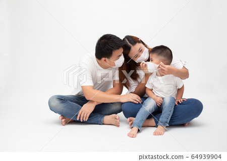 Asian family wearing protective medical mask for 64939904