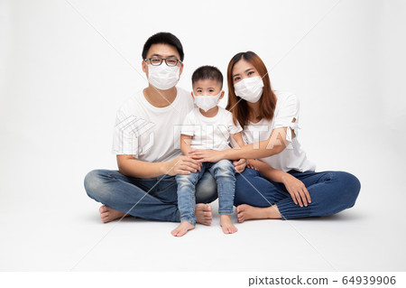 Asian family wearing protective medical mask for 64939906