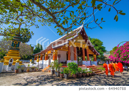 Wat Saen suk ka ram,buddish religion temple at Luang prabang Laos in day time with monks. Wat Saen suk ka ram,buddish religion temple at Luang prabang Laos in day time with monks. 64940788