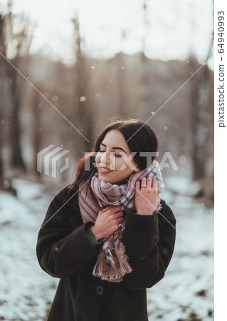 Young beautiful model posing in winter forest. stylish fashion portrait Young beautiful model posing in winter forest. stylish fashion portrait 64940993