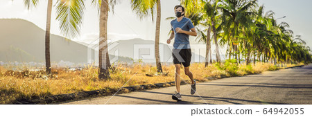 Runner wearing medical mask, Coronavirus pandemic Covid-19. Sport, Active life in quarantine Runner wearing medical mask, Coronavirus pandemic Covid-19. Sport, Active life in quarantine 64942055