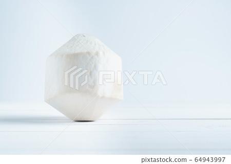 Tropical drinking coconut on white wood background. 64943997