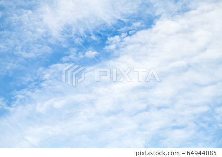 Natural cloudy background photo. White altocumulus Natural cloudy background photo. White altocumulus 64944085