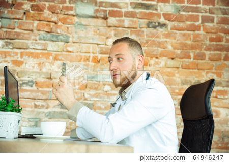 Caucasian doctor consulting for patient, explaining recipe for drug, working in cabinet Caucasian doctor consulting for patient, explaining recipe for drug, working in cabinet 64946247