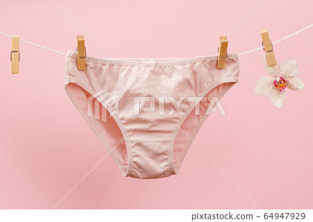 Beautiful women's cotton panties on pink 64947929