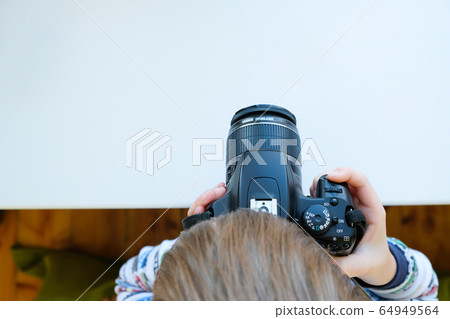 a 6 year old boy photographs his toys a 6 year old boy photographs his toys 64949564