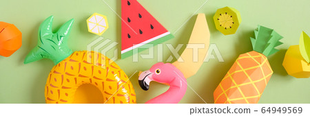 Exotic fruits made of paper on green background Exotic fruits made of paper on green background 64949569
