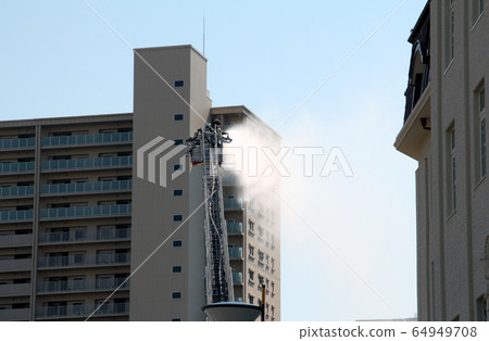 Firefighter of a ladder car 64949708