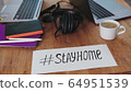 home office during the coronavirus pandemic. two laptops, a tablet, pens, headphones are on the kitchen table. work from home. self-isolation 64951539