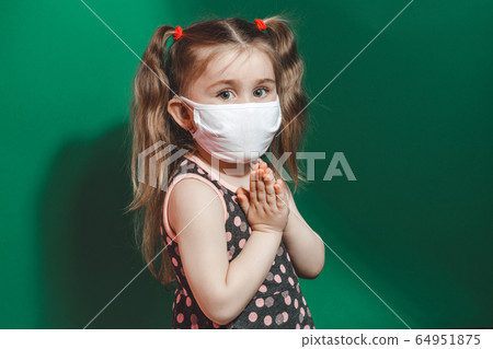 Caucasian sick little girl in medical mask during 64951875