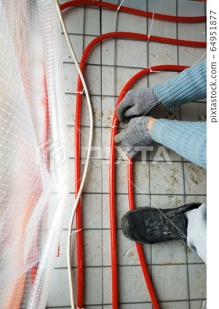 Modern manual storage of underfloor heating in a Modern manual storage of underfloor heating in a 64951877