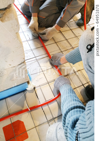 Modern manual storage of underfloor heating in a Modern manual storage of underfloor heating in a 64951878