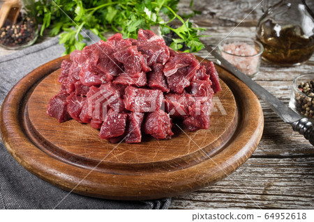Beef stew prepared on a chopping board. Beef stew prepared on a chopping board. 64952618