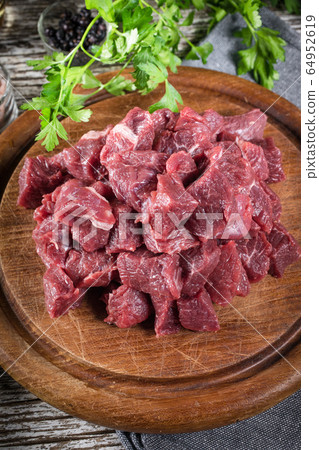 Beef stew prepared on a chopping board. Beef stew prepared on a chopping board. 64952619