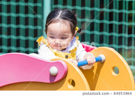 Family with children Parents and children playing in the park 64953964