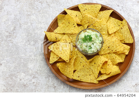 Tortilla chips avocado dip 64954204