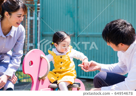 Family with children Parents and children playing in the park 64954678