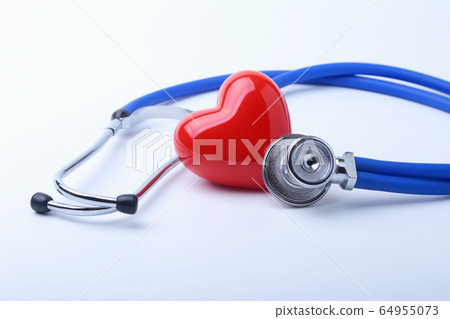 Medical stethoscope and red heart isolated on white. 64955073