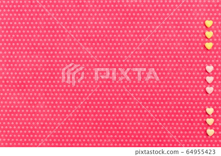 A plush fuchsia background in white polka dots 64955423
