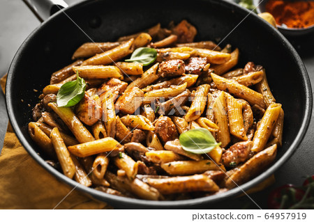 Pasta penne with mushrooms and sauce Pasta penne with mushrooms and sauce 64957919