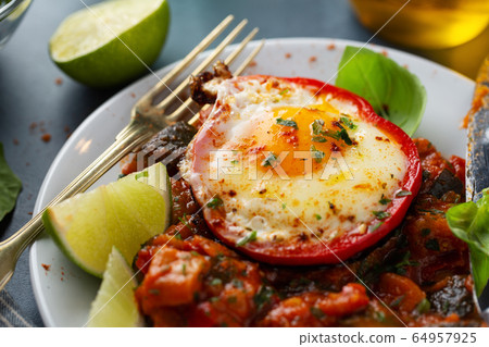 Fried egg with vegetables on plate Fried egg with vegetables on plate 64957925