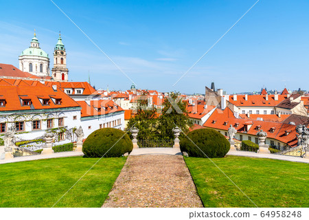Vrtbovska Garden in Prague. Terraced baroque garden and overview of Lesser Town with St Nicholas Church dome, Prague, Czech Republic Vrtbovska Garden in Prague. Terraced baroque garden and overview of Lesser Town with St Nicholas Church dome, Prague, Czech Republic 64958248