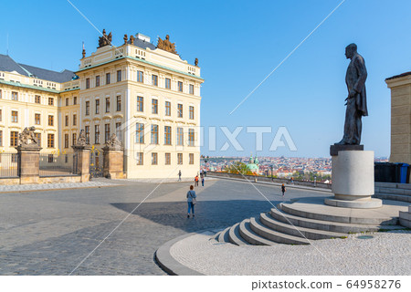 Hradcany square with entrance gate to Prague Castle and statue of Tomas Garrigue Masaryk - the first President of Czechoslovakia, Praha, Czech Republic 64958276